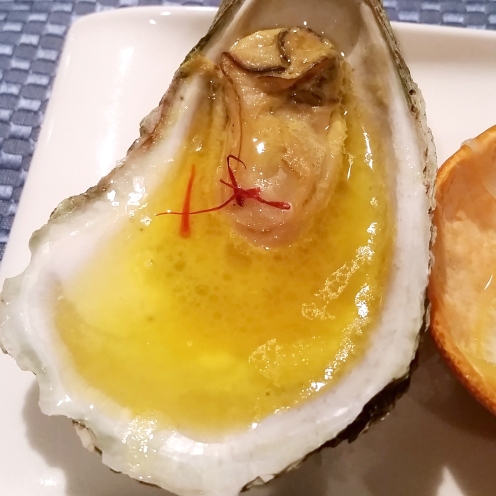 Poached Oyster in Butter Champagne and Saffron